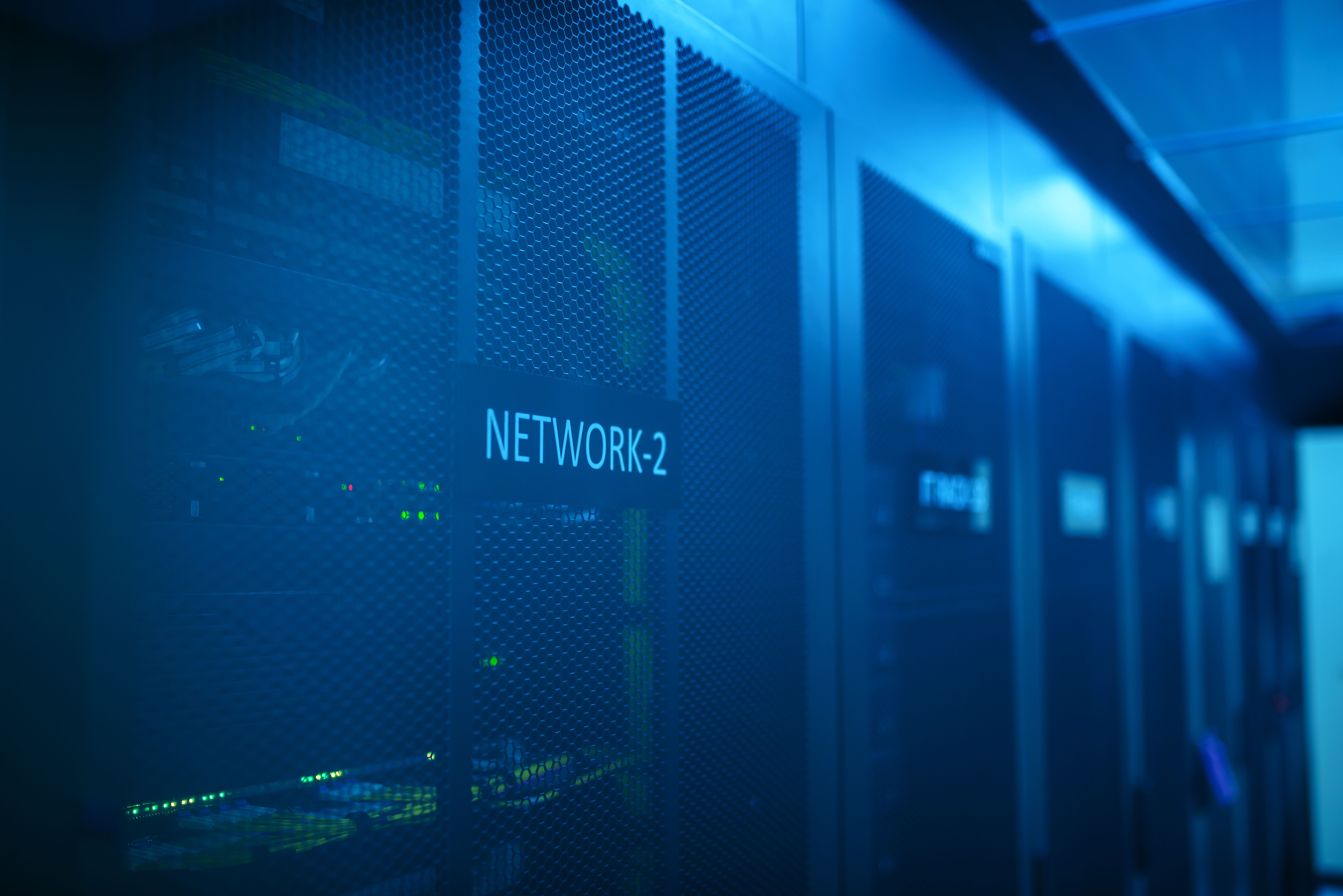 Modern network server room with blue lighting